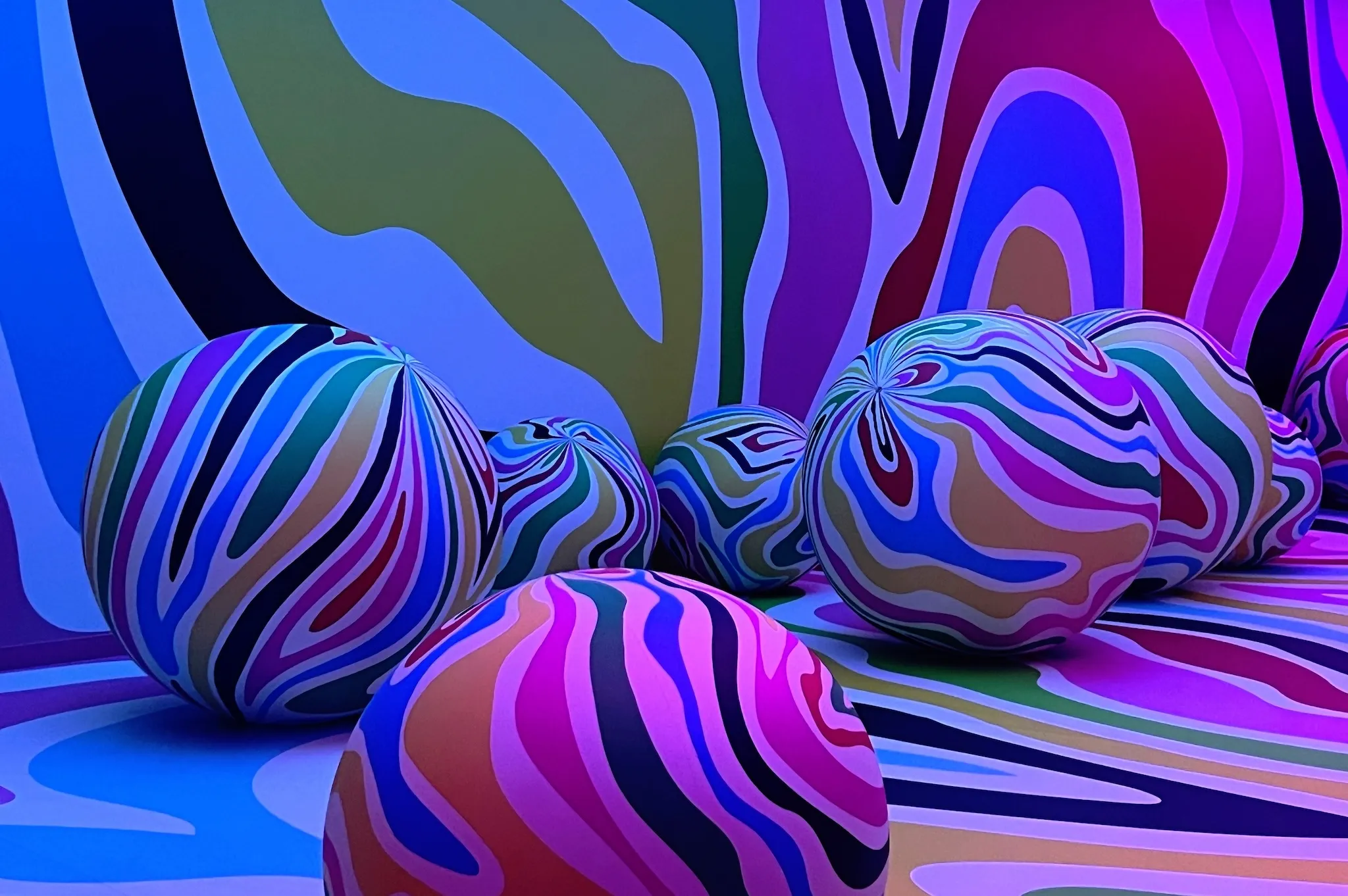 Spherical balloons illustrated with abstract drawings at the Balloon Museum's "EmotionAir" exhibition.