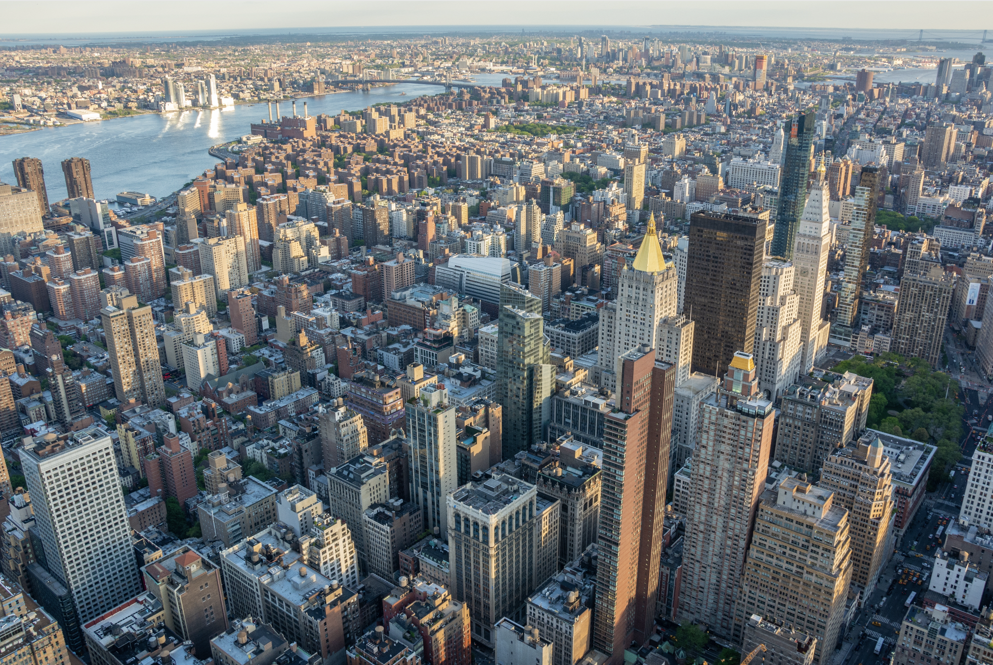 The city will turn this 34th Street parking lot on the East River into a public space with an outdoor gym