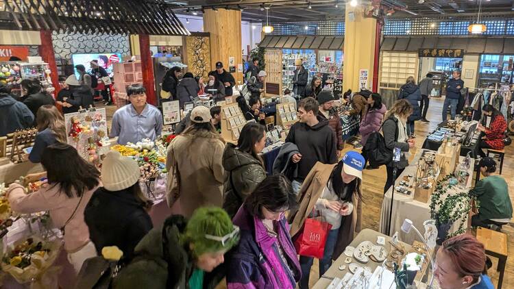 People shopping at the Japanese Holiday Market inside of Japan Village in Brooklyn People shopping at the Japanese Holiday Market inside of Japan Village in Brooklyn