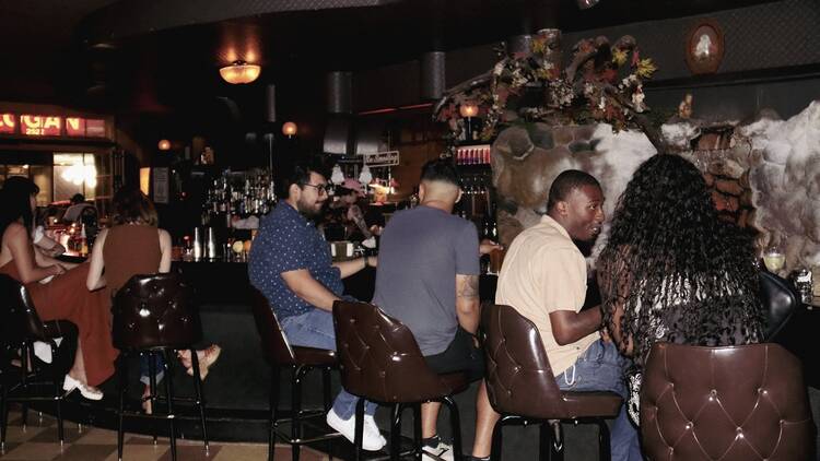 Patrons sit at The Owl's main bar. Patrons sit at The Owl's main bar.