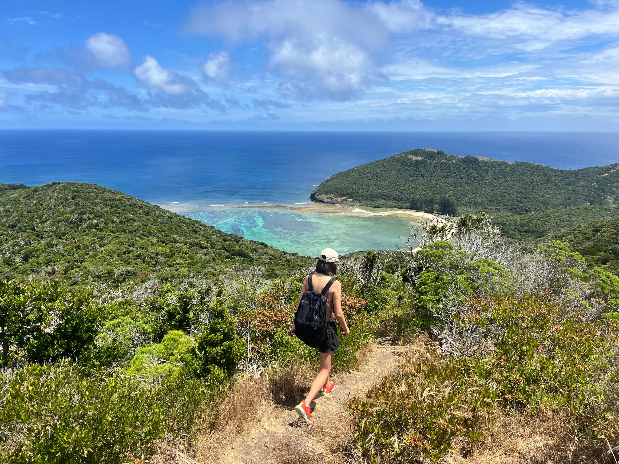 Girl walking on coastal track