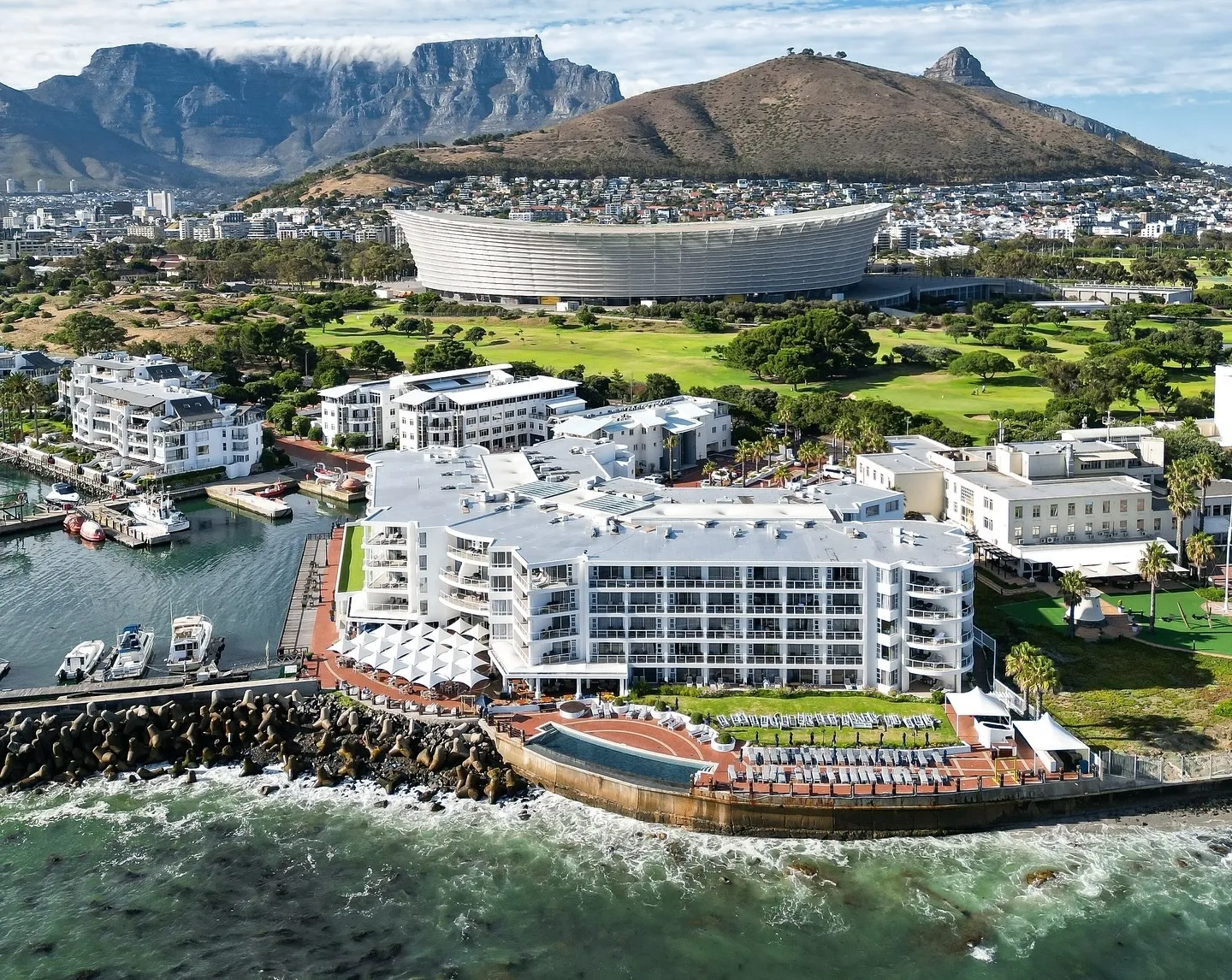 Radisson Collection Hotel, Waterfront Cape Town with DHL Stadium and Table Mountain in the background