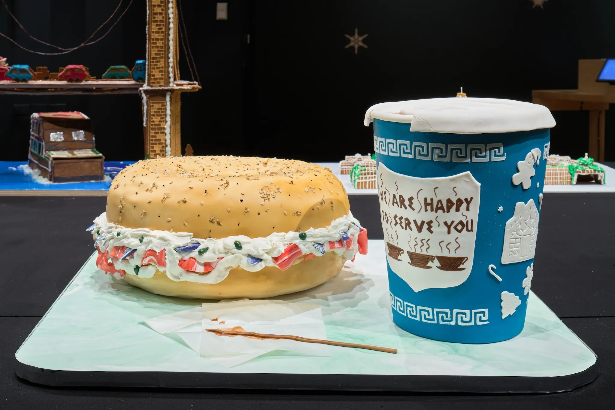 A gingerbread version of a bagel and coffee.