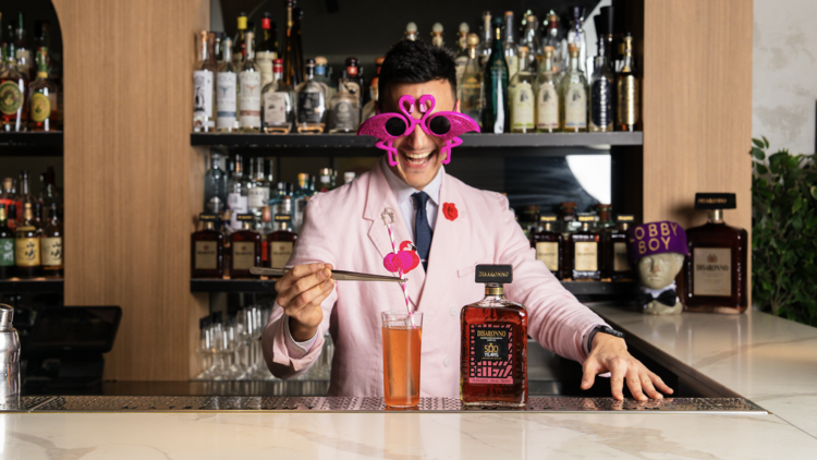 Bartender pouring a cocktail with Disaronno