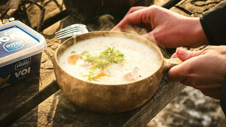 Cook and enjoy salmon soup over an open fire
