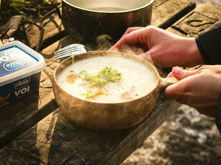 Cook and enjoy salmon soup over an open fire