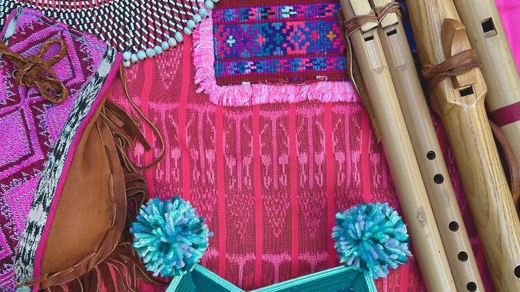 Handwoven fabrics and wooden flute instruments