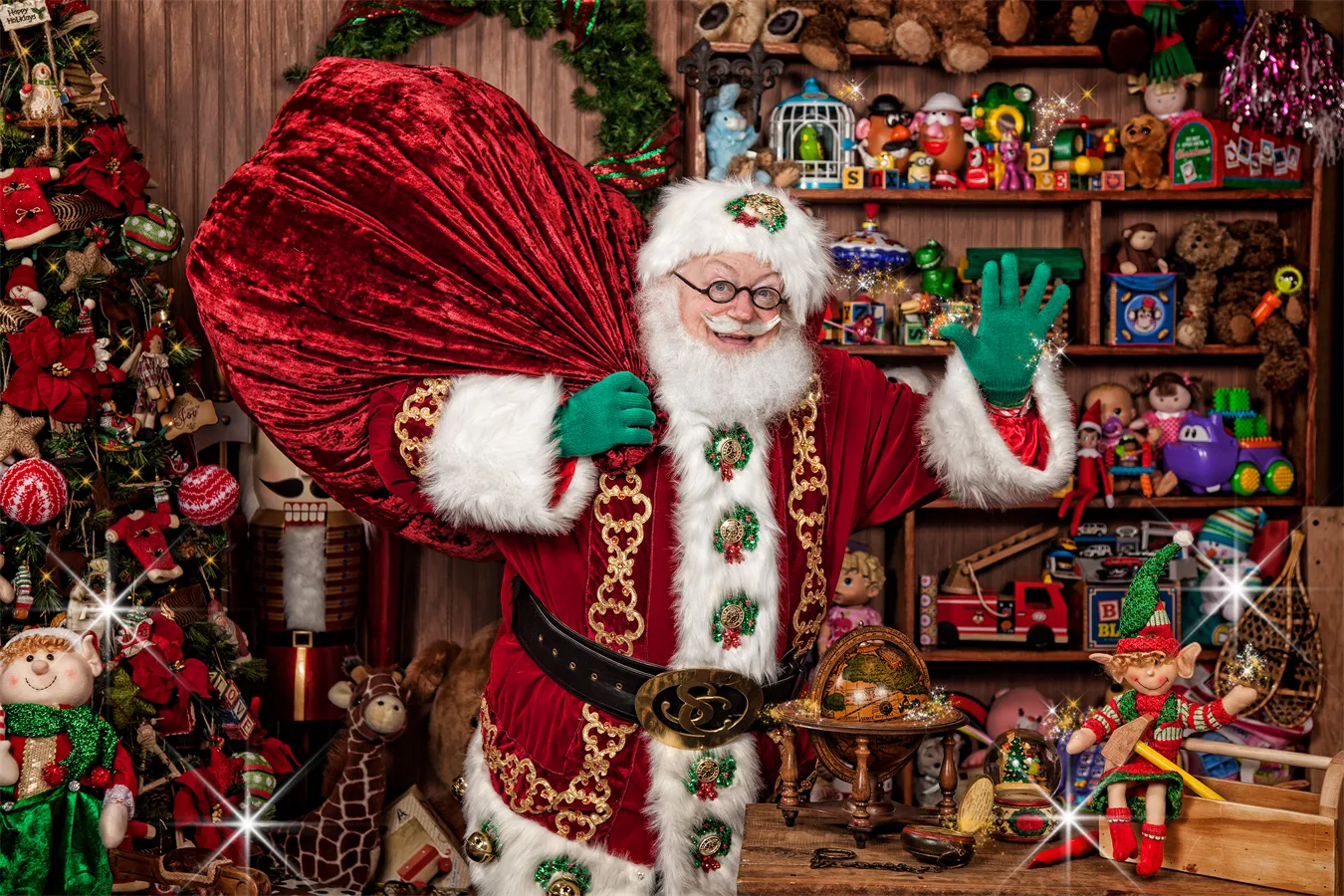 Santa carrying a bag of toys and waving