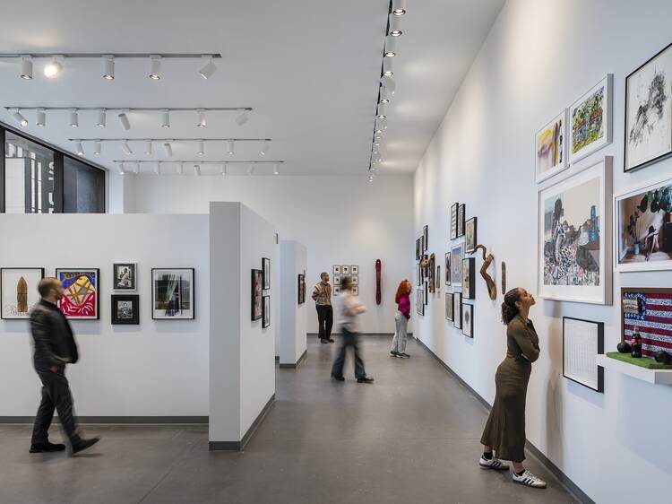 People look at artwork inside The Studio Museum in Harlem. People look at artwork inside The Studio Museum in Harlem.