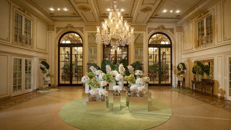 The lobby of the Plaza hotel with fresh flowers.