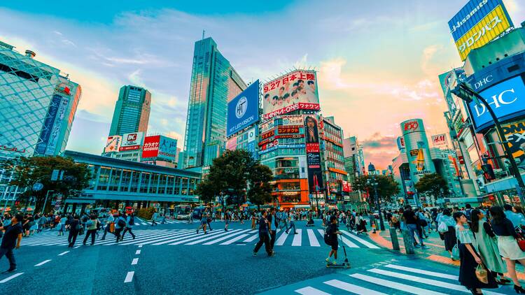 Shibuya crossing with bright lights and people