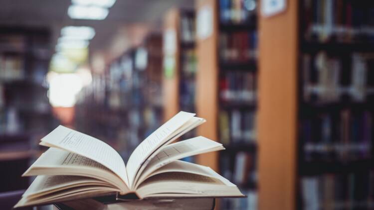 Close-Up Of Open Book In Library Close-Up Of Open Book In Library