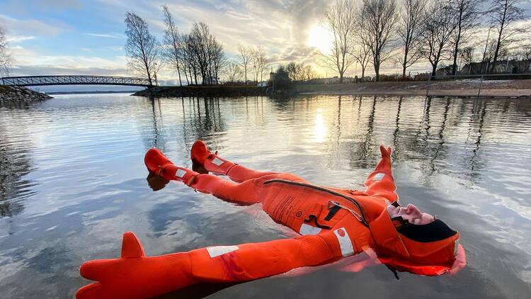 Float in icy water in a survival suit