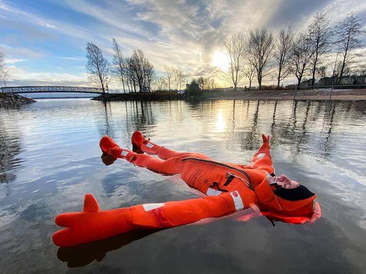 Float in icy water in a survival suit