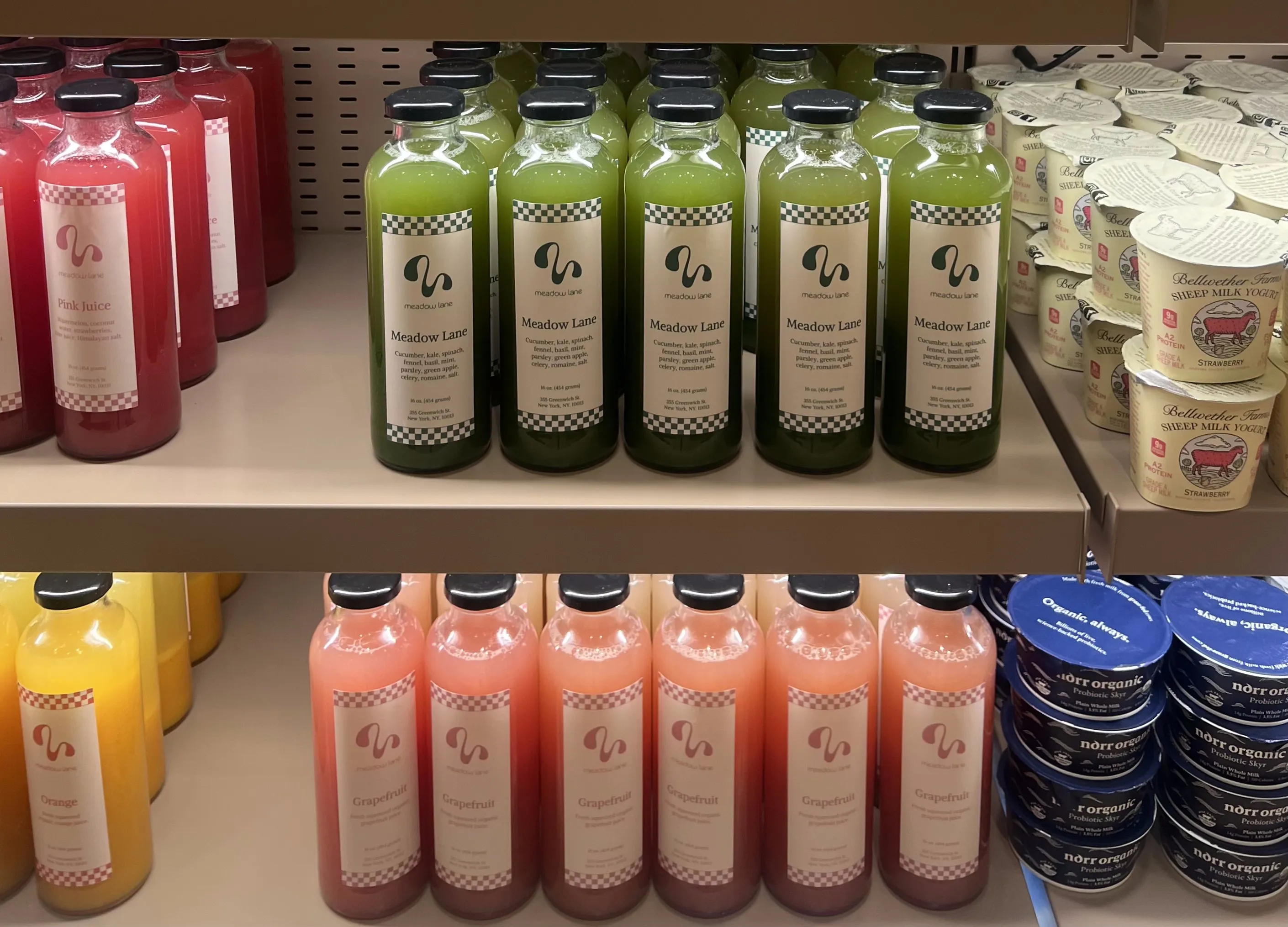 A row of fresh juices at Meadow Lane gourmet grocer