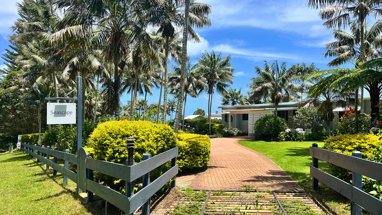 Seascape Norfolk Island Accommodation with Norfolk trees in garden