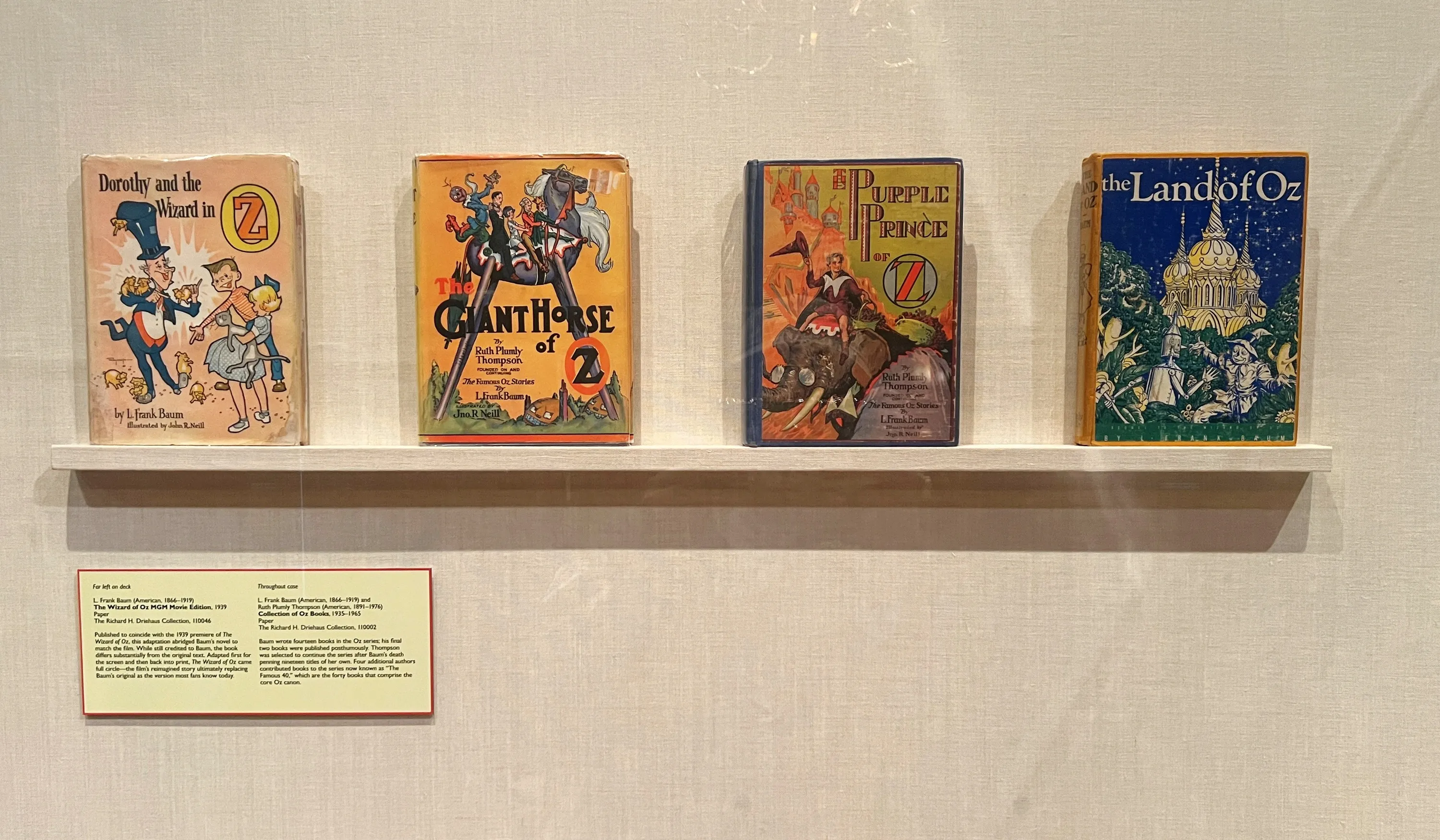 A collection of "Wizard of Oz" books on display at "Land of Oz: Beyond the Page" at the Driehaus Museum.