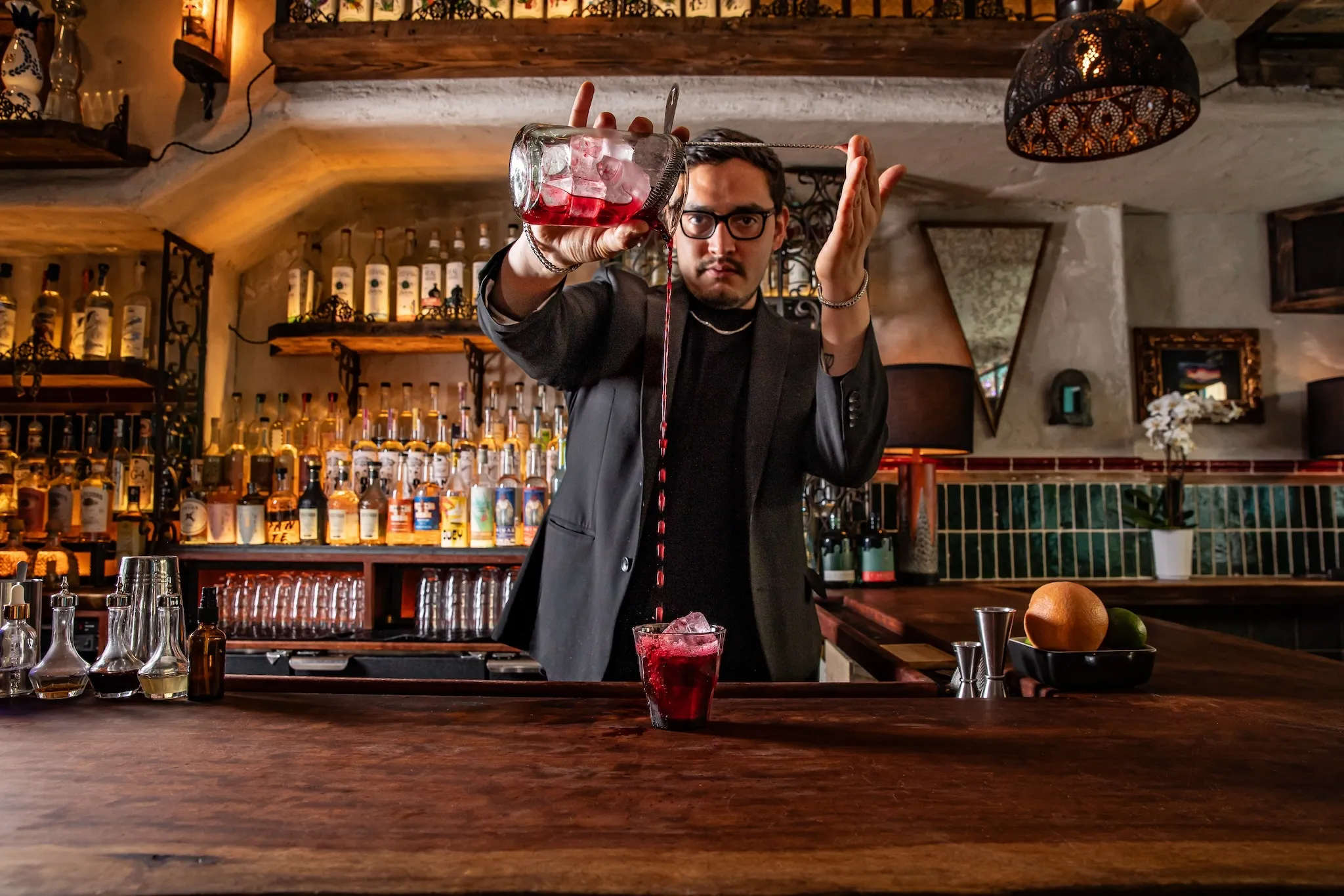 Beverage Manager José María “Chema” Dondé Rangel pouring a red drink