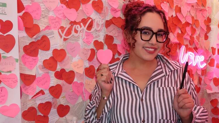 Amanda Anderson stands in one of The Last Chapter's photo booths.