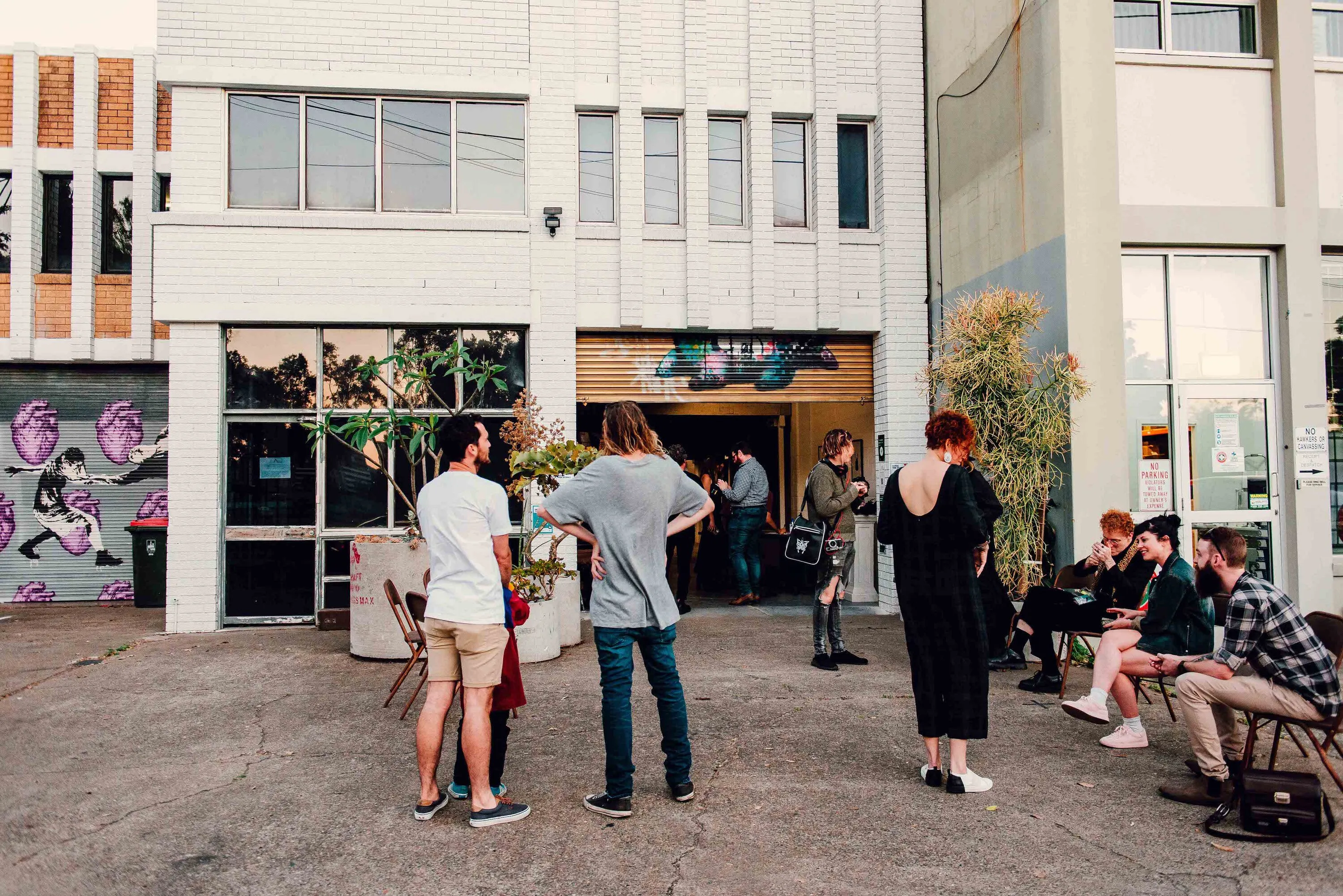 People waiting outside building