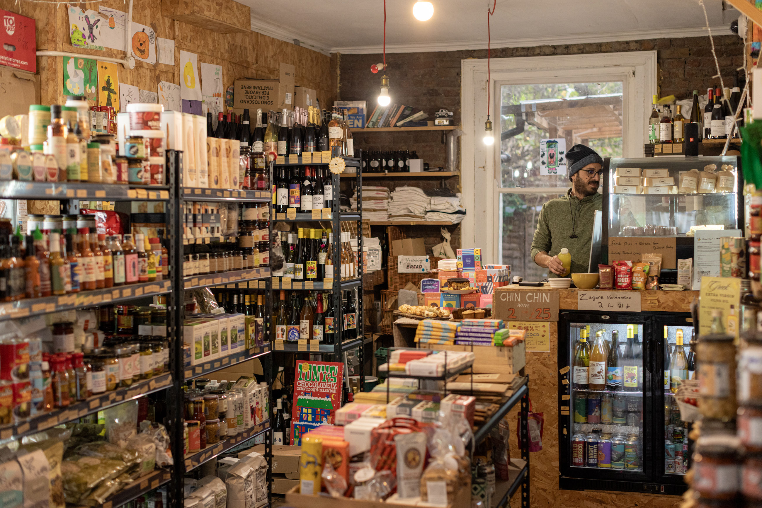 Inside Nourished Communities, an independent grocery store with packed shelves