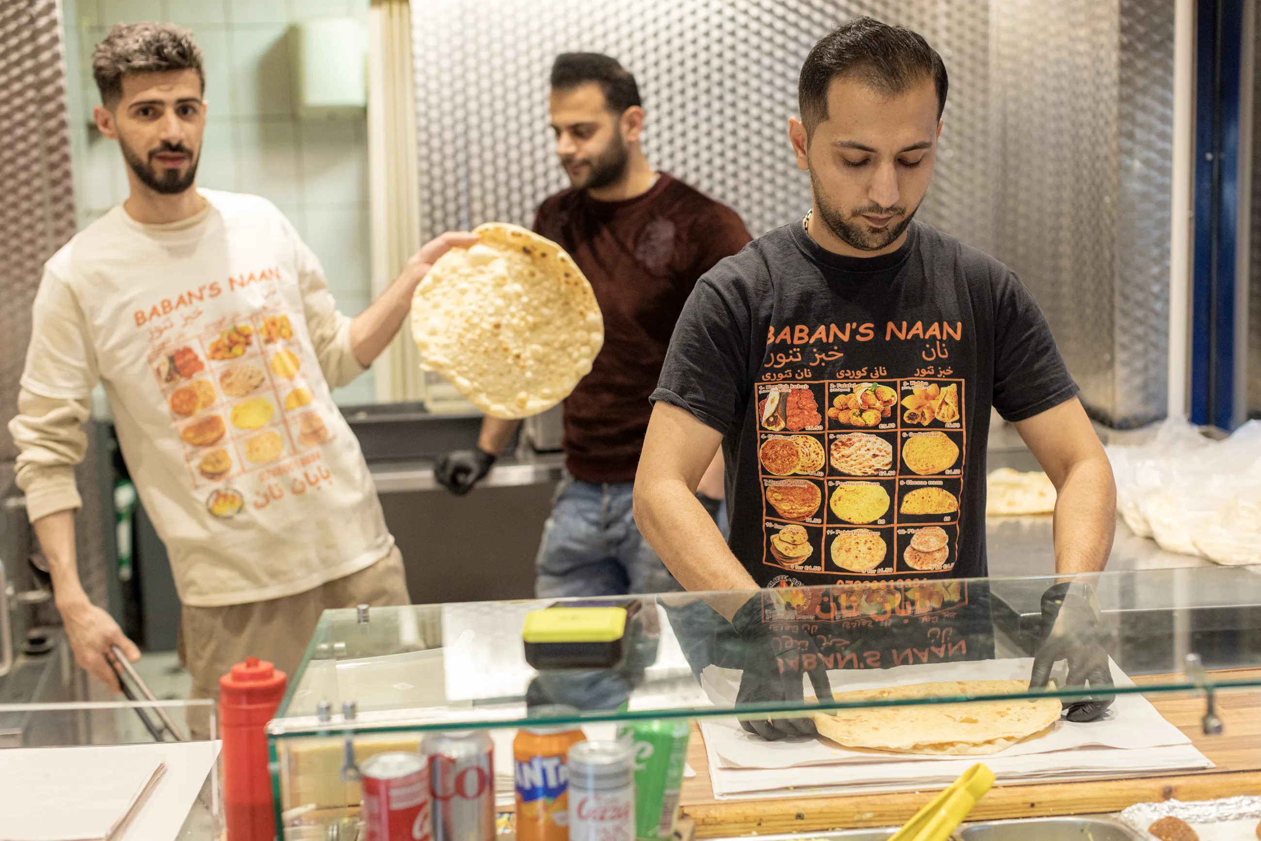 Men working behind the counter at Baban’s Naan 