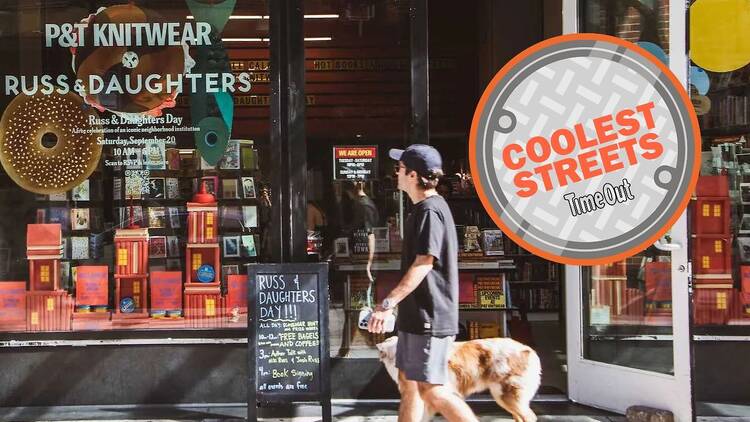 A man walks a dog past P&T Knitwear bookstore.