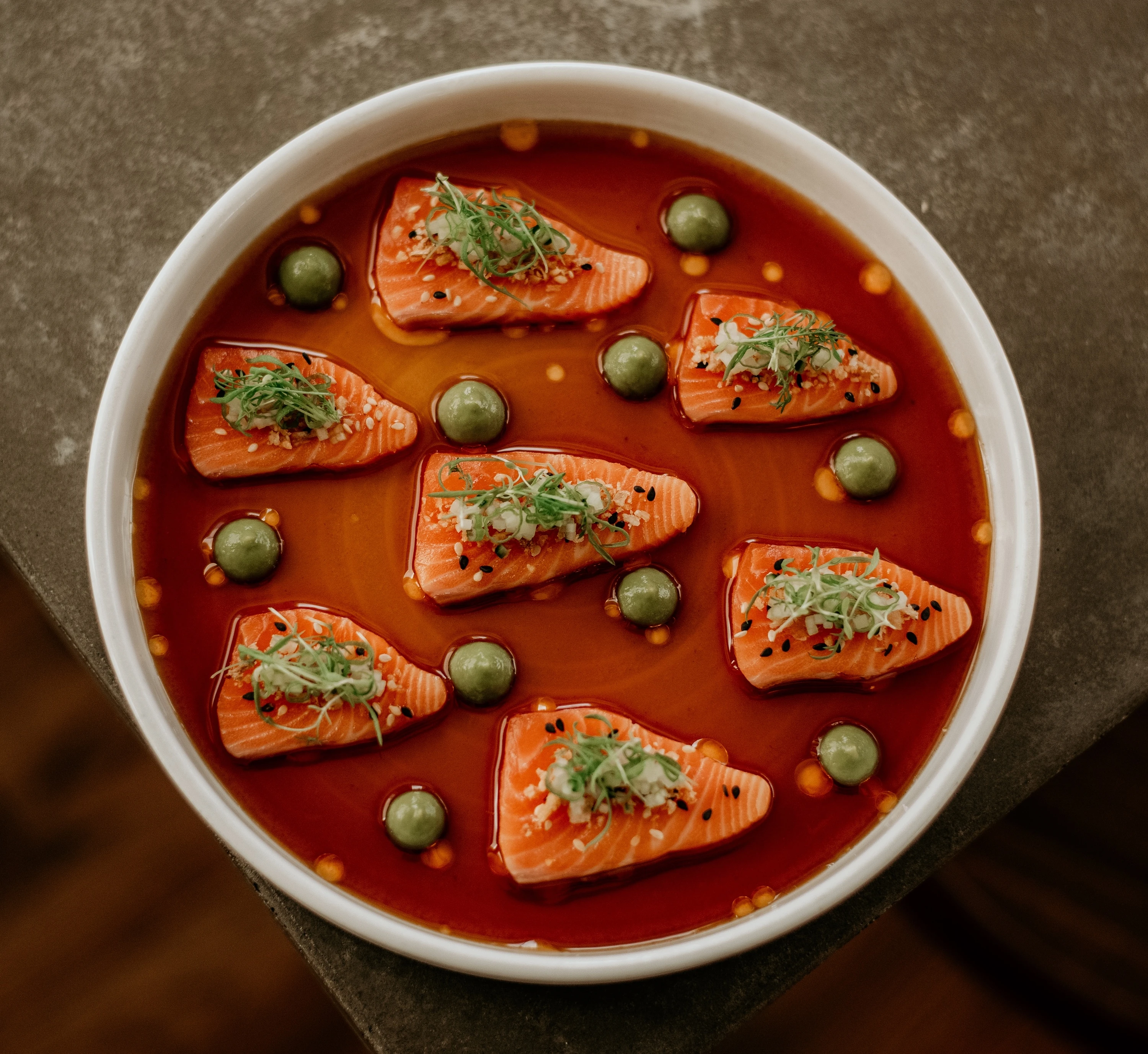 A plate of salmon sashimi from Barnacle by Bar Bravo