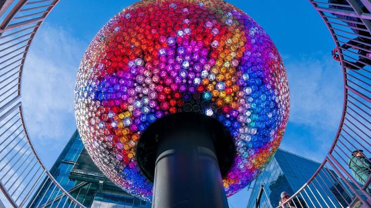 The Times Square Ball 2026 lit up in vibrant colors. The Times Square Ball 2026 lit up in vibrant colors.
