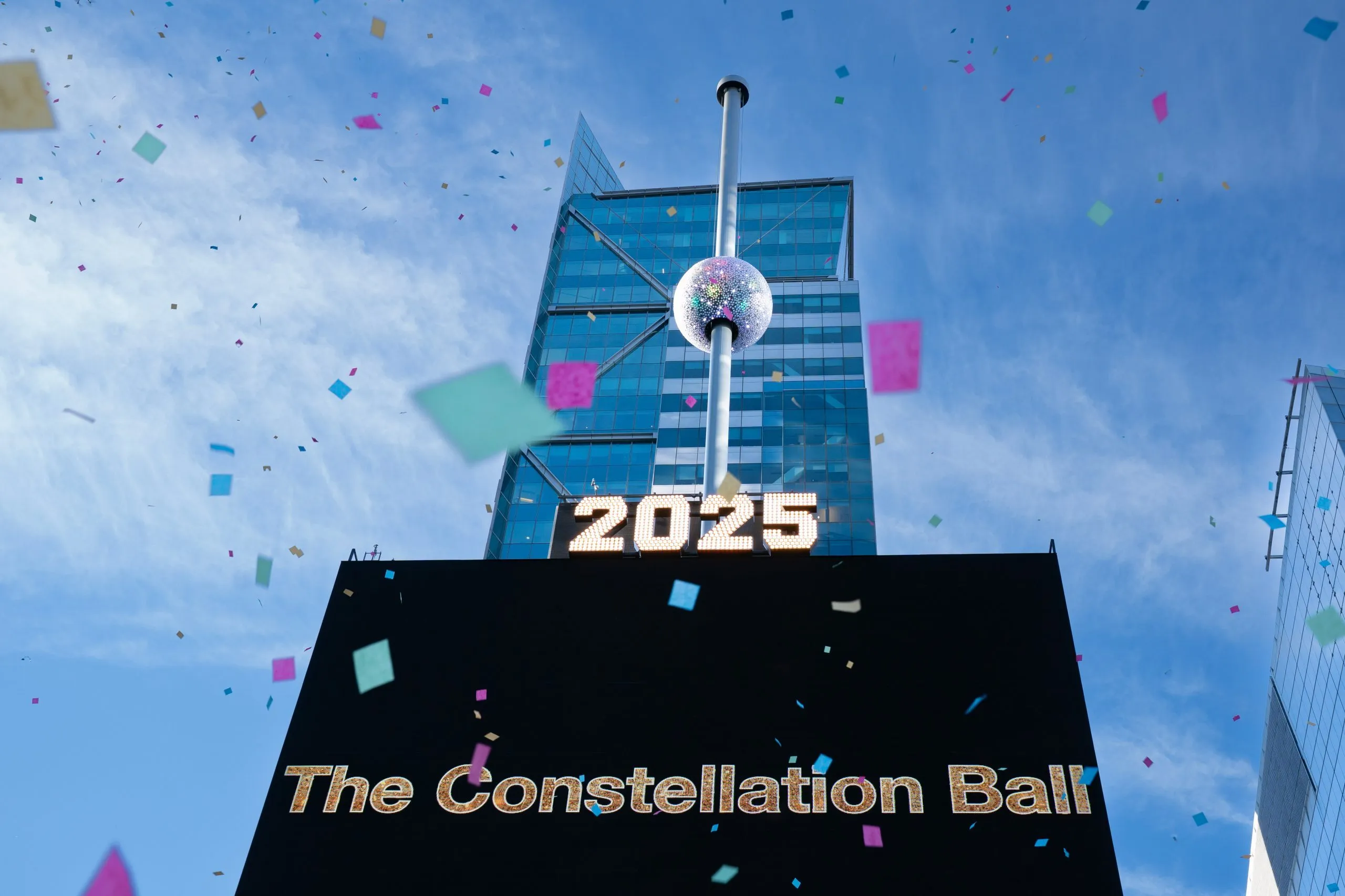 The Times Square Ball 2026 lit up in vibrant colors.