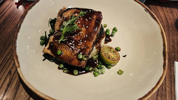 Salmon teriyaki with bok choy, edamame, and mashed potato at La Cuna Bistro