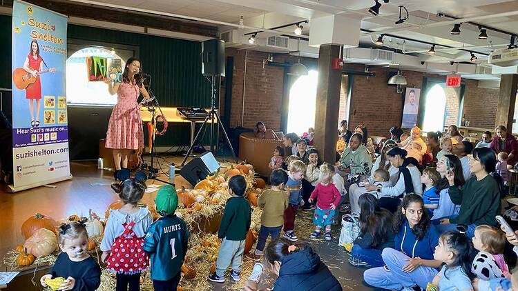 Kid's performer Suzi Shelton on stage at Time Out Market New York