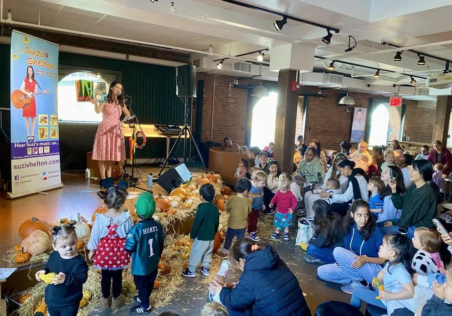 Kid's performer Suzi Shelton on stage at Time Out Market New York