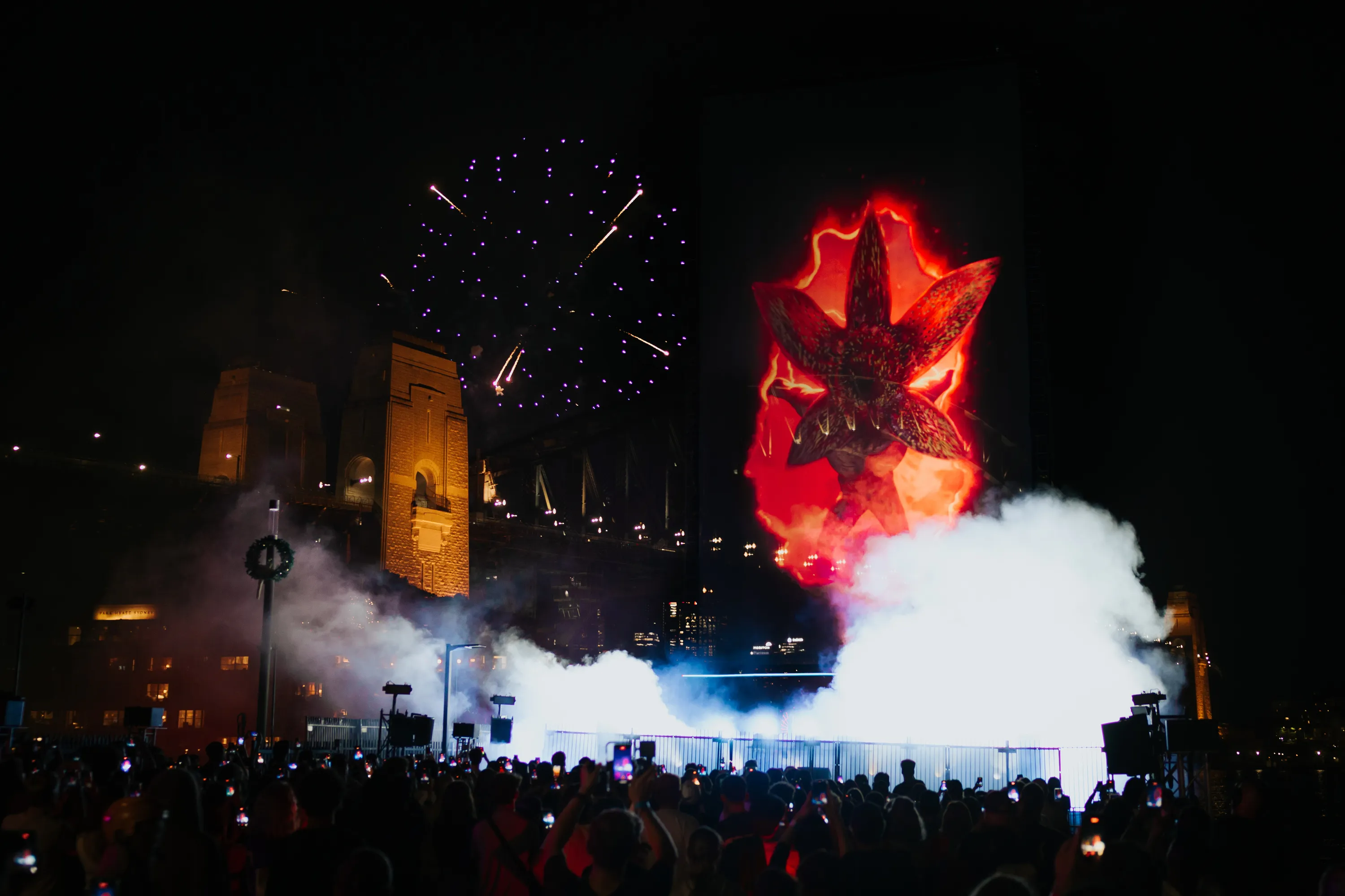 red light and projections over Sydney Harbour