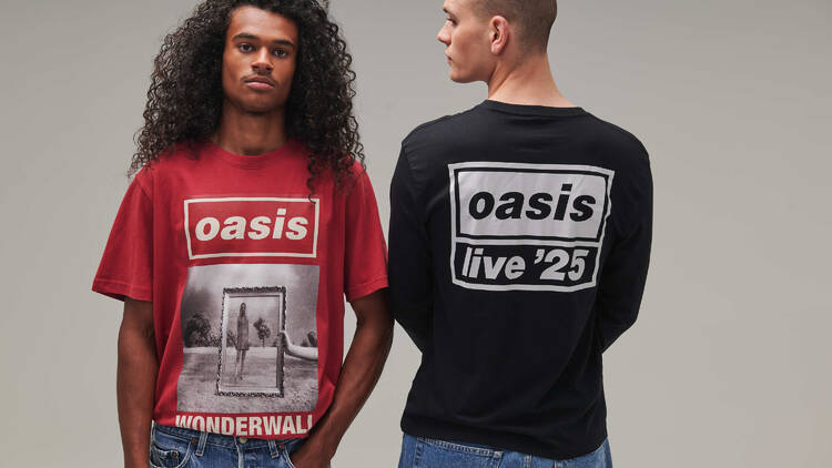 Models showing off new Oasis merch available at a December 2025 pop-up store