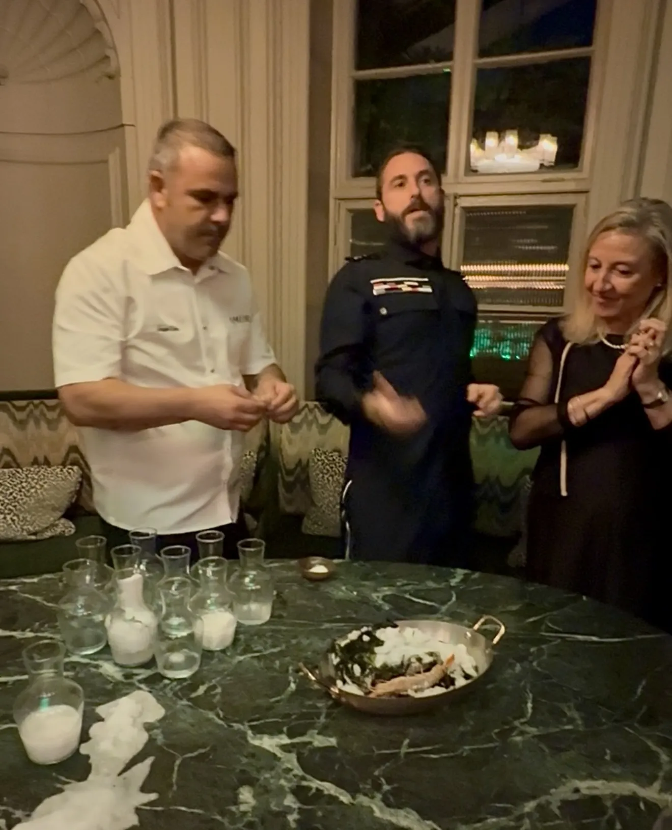  Chef Angel Leon and Carlos Leon demonstrating a unique cooking technique for prawns with 'living salt' that crystallises and cooks the prawns naturally due to the salt reaction.