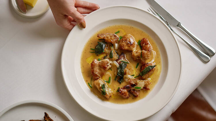 Harriot A plate of food on a white table at Harriot.