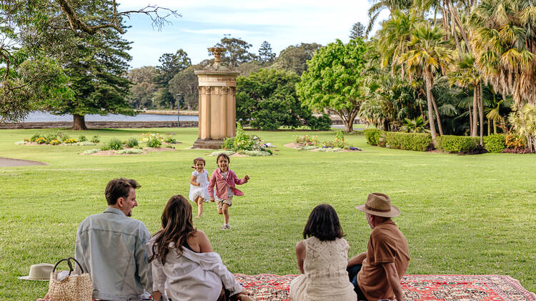 Family having a picnic at the Royal Botanic Garden Sydney
