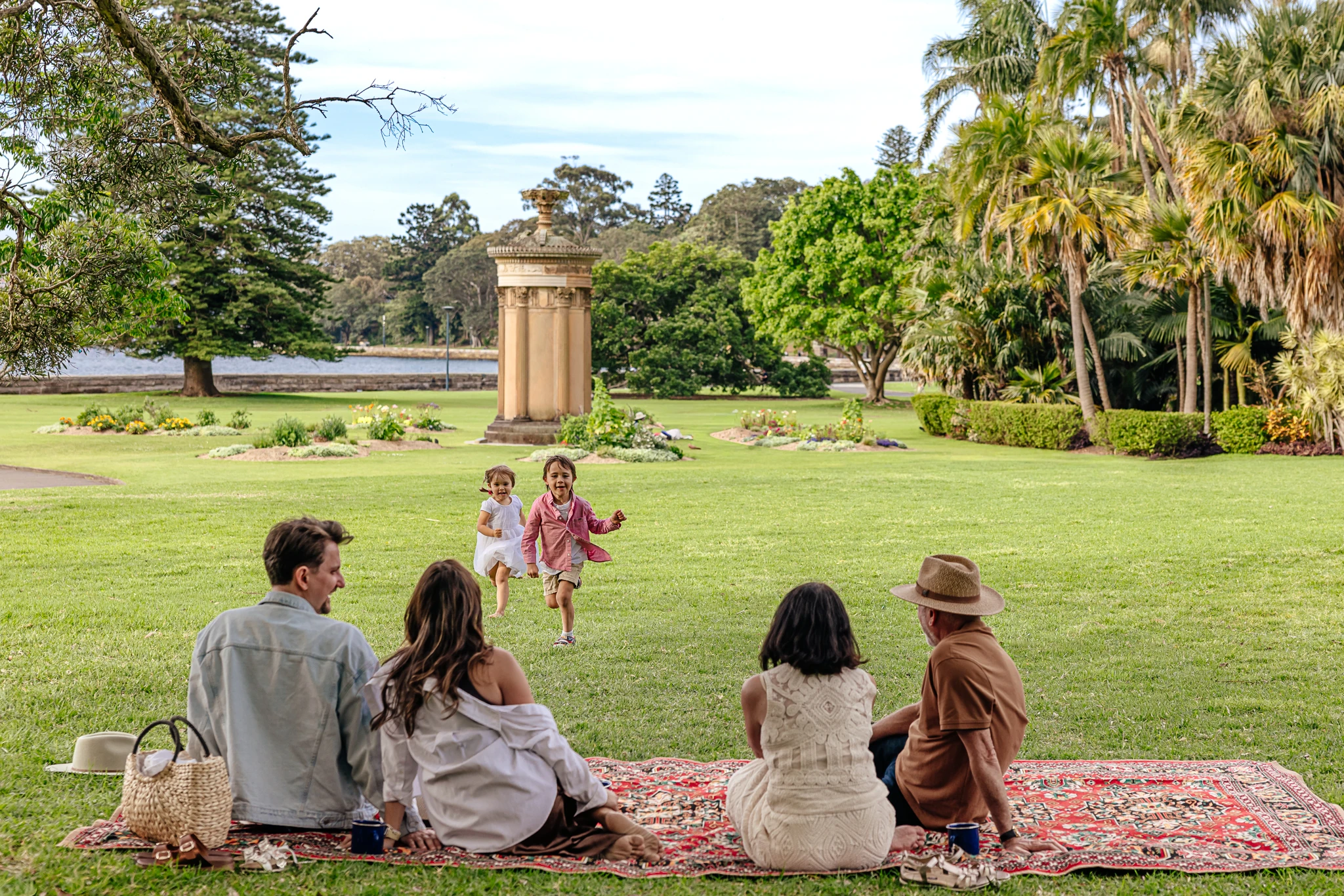 Family having a picnic at the Royal Botanic Garden Sydney