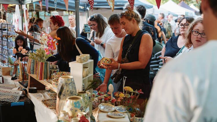 Coburg Night Market People at a market stall.