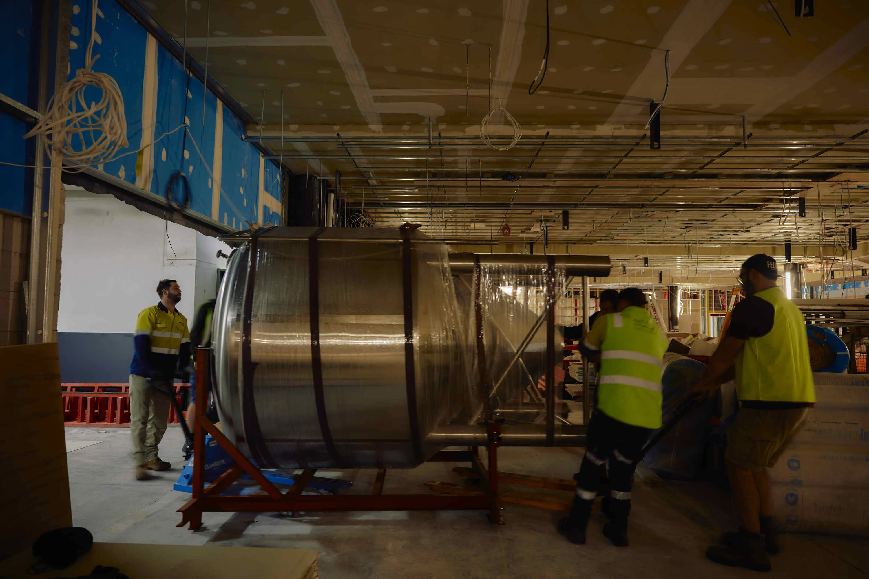 A tank being installed in Felons Barrel Room
