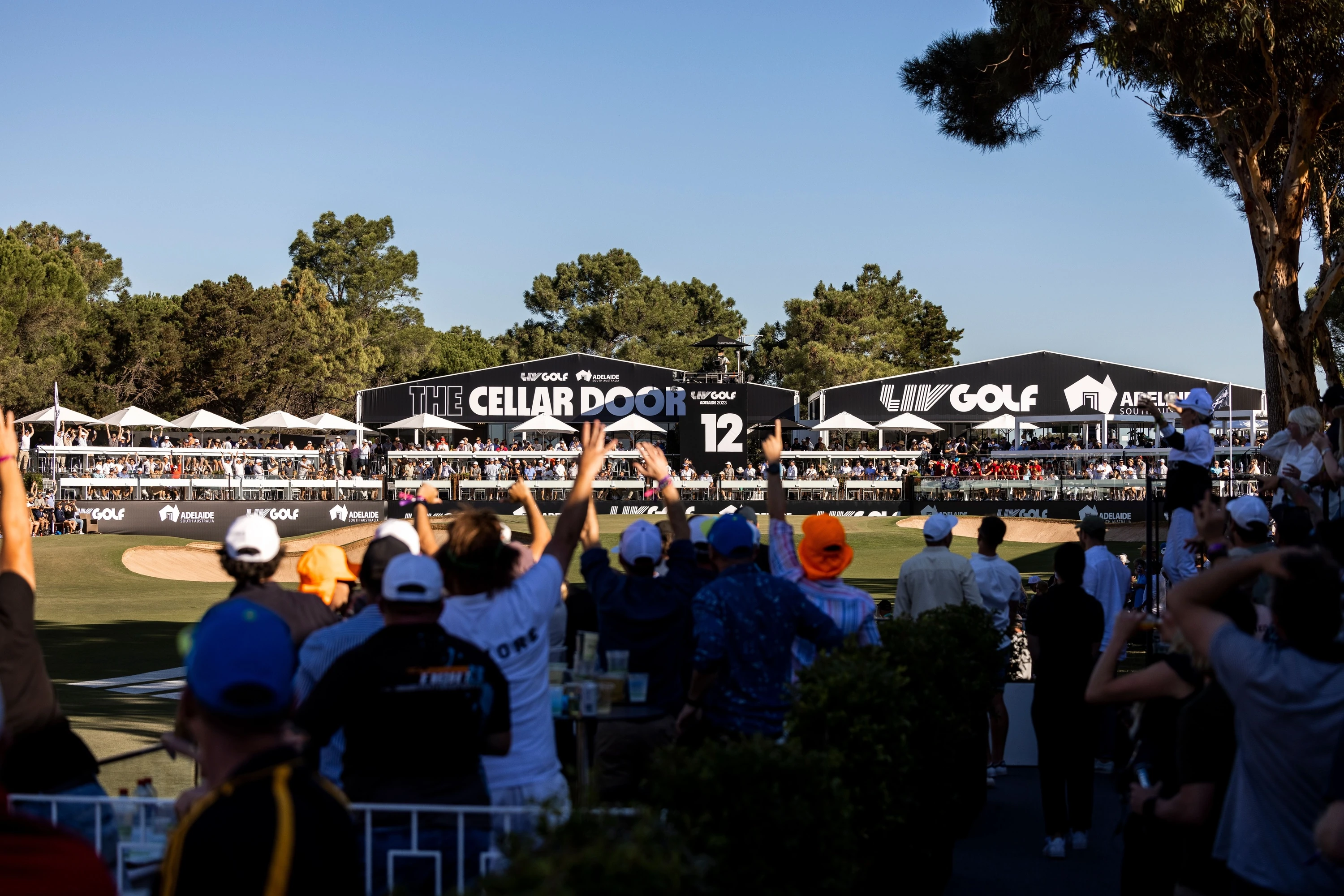 Spectators watching golf