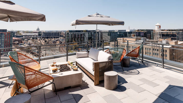 A rooftop restaurant with a view of the Capitol. A rooftop restaurant with a view of the Capitol.