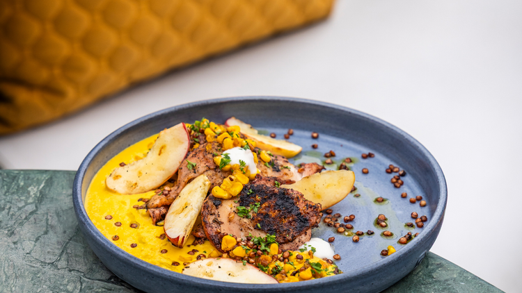 The Greenhouse's succulent Sumac-grilled chicken thighs with corn cream and grilled peaches The Greenhouse's succulent Sumac-grilled chicken thighs with corn cream and grilled peaches