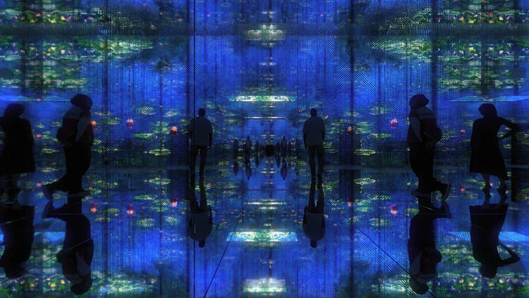 People inside of an immersive art show experience People inside of an immersive art show experience