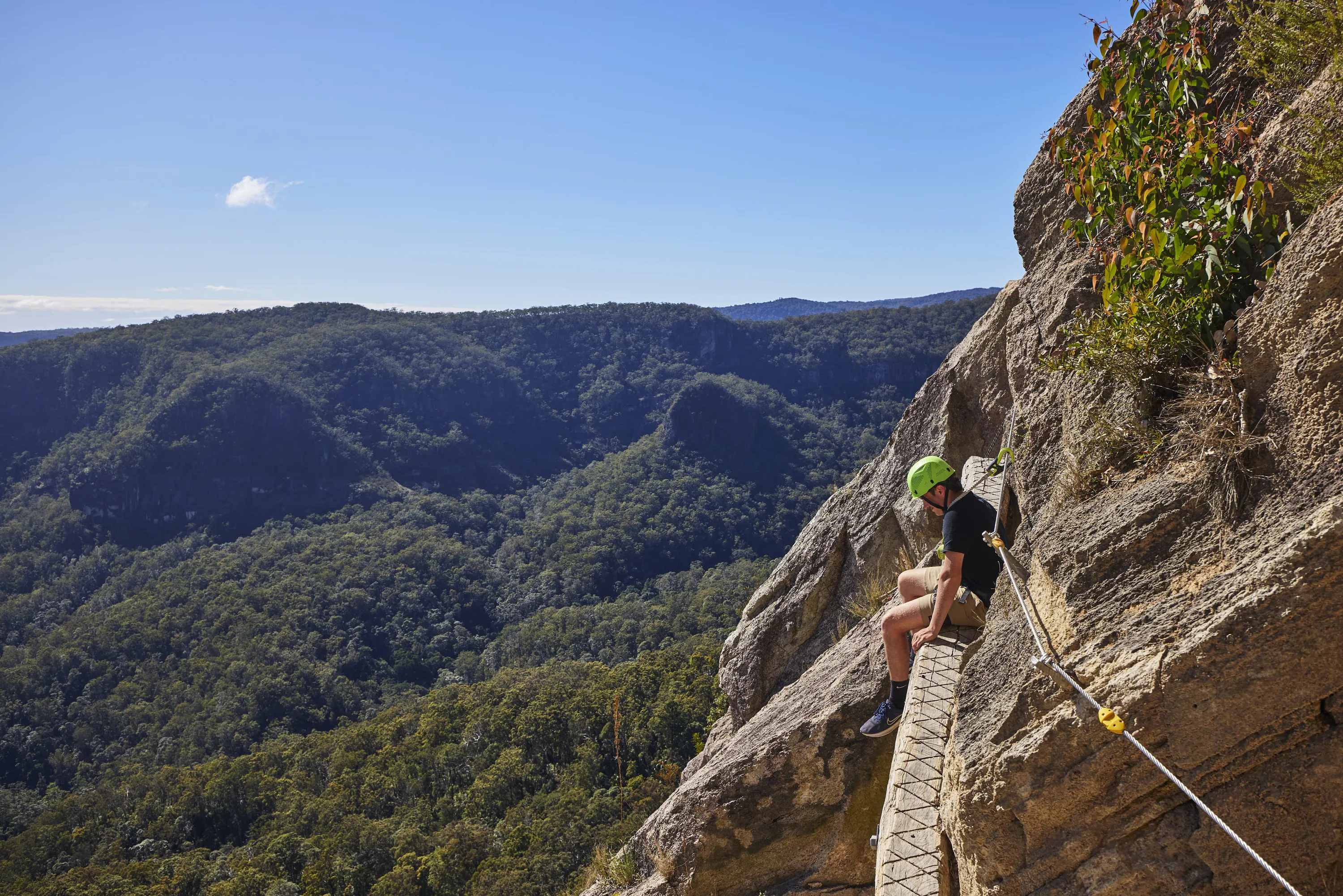 Man sitting on cliff edge