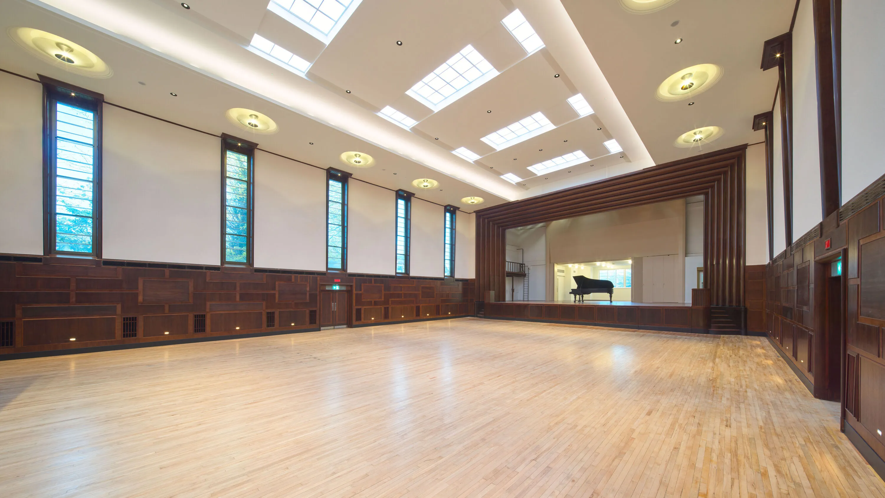 Image of empty assembly hall with piano on stage at Hornsey Town Hall in North London 