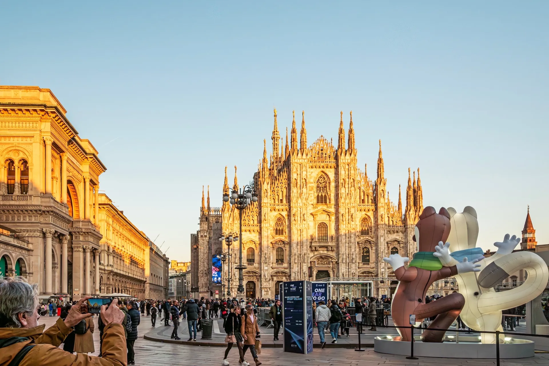 Italy Milan 21.03,25 Milan Cathedral (Duomo di Milano) at Golden Hour Piazza del Duomo with Event Setup for Milano Cortina 2026