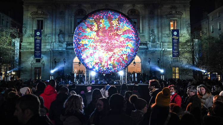 Big round and colourful light sculpture in Helsinki LUX light festival