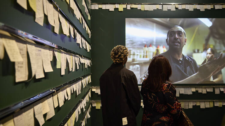 People at the 'Order Up' exhibition at the Immigration Museum.